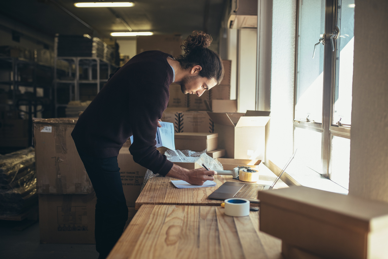 Man Working in Drop Shipping Office